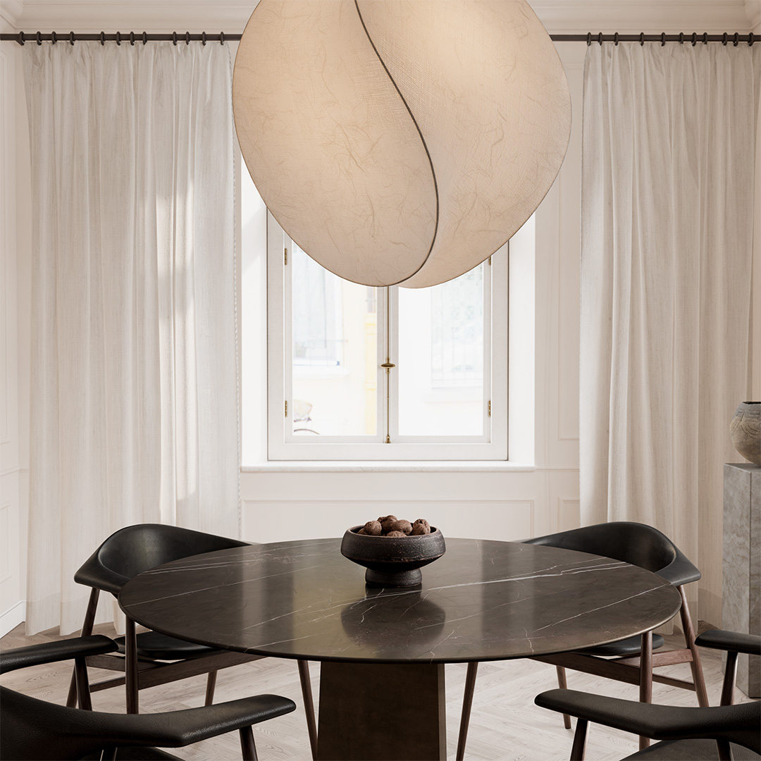 Sala da pranzo con tavolo scuro e sospensione scultorea