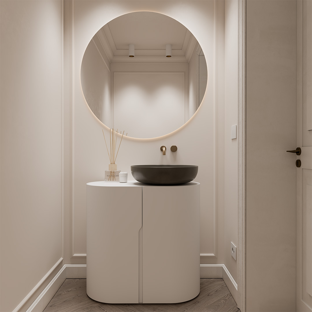 Bagno con mobile curvo e specchio retroilluminato